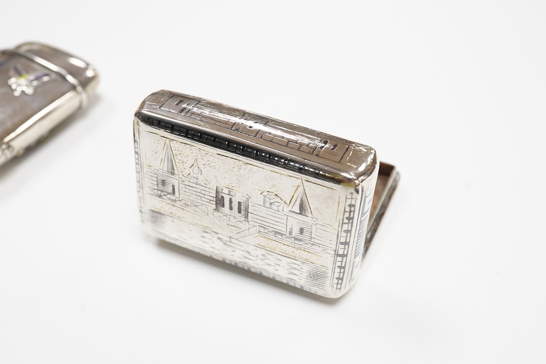 A Japanese white metal and polychrome enamel vesta case, decorated with flowers and butterfly, 56mm, together with a 19th century Russian 84 zolotnik and niello snuff box(tired), a modern silver pill box and a silver mou